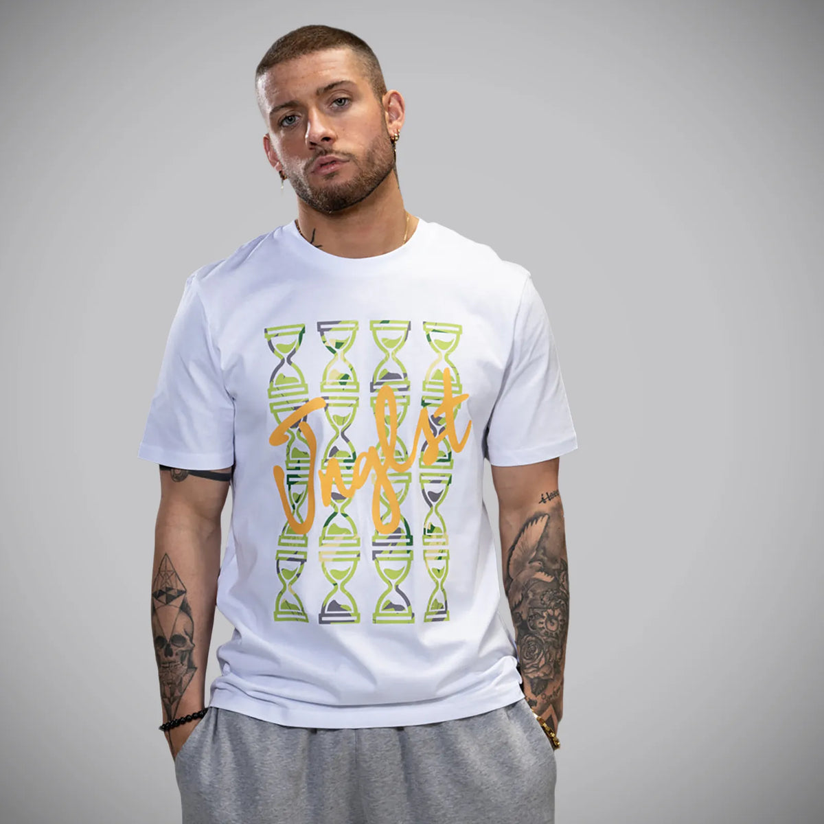 A man wearing a white crewneck t-shirt with a graphic print Green Timepiece Triple 3 Skateboarding T Shirt