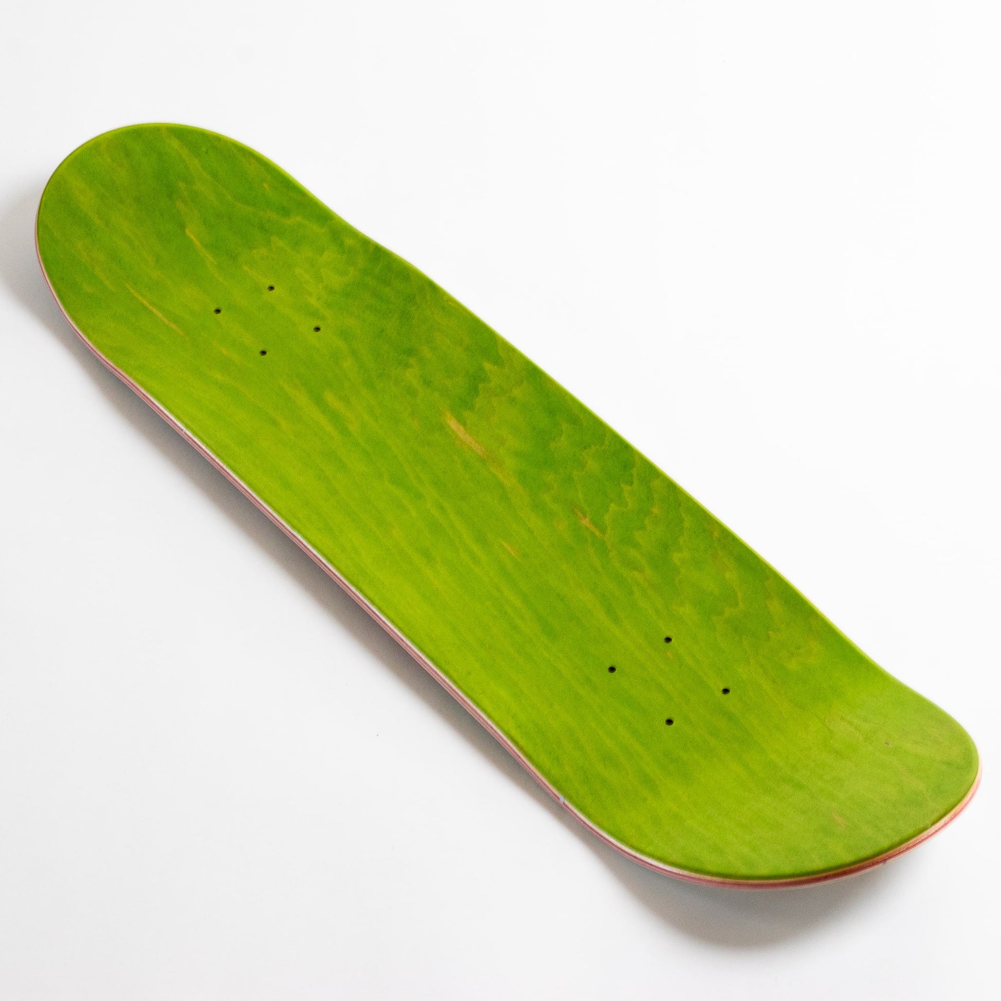 top green ply triple 3 skateboards deck on a white background