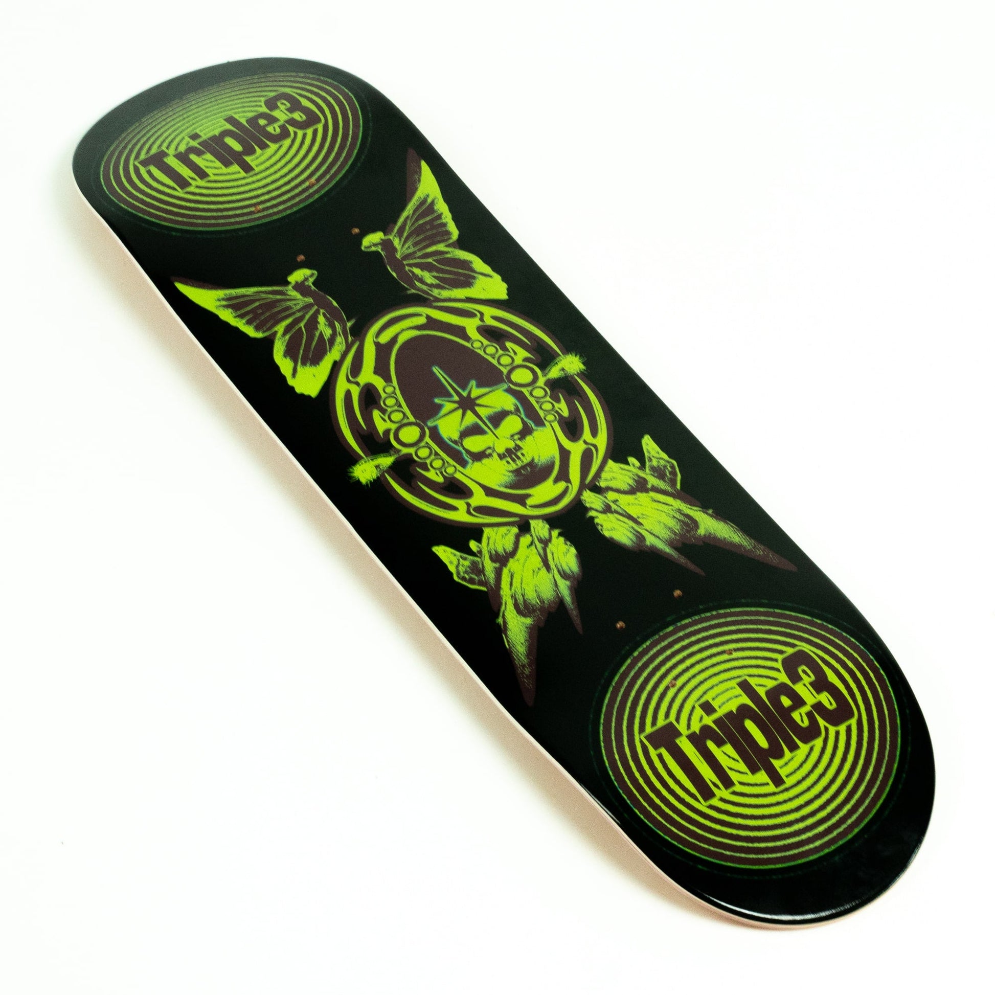A skateboard deck with a black background and a vibrant lime green graphic design featuring a skull, butterflies, and the Triple 3 logo in two circular spots.