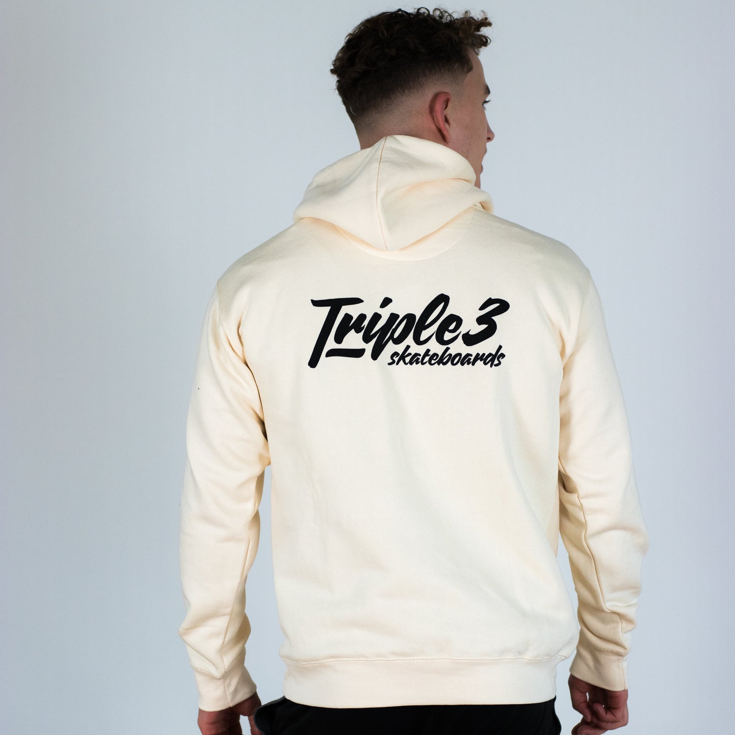 model wearing triple 3 skateboards ivory hoody