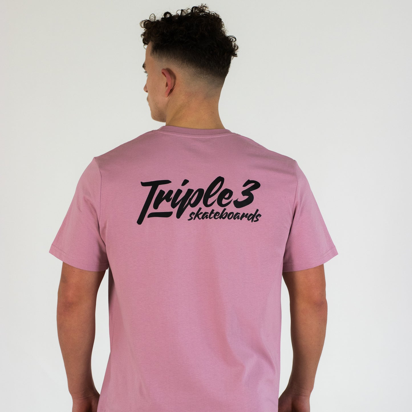 model wearing pink t shirt from triple 3