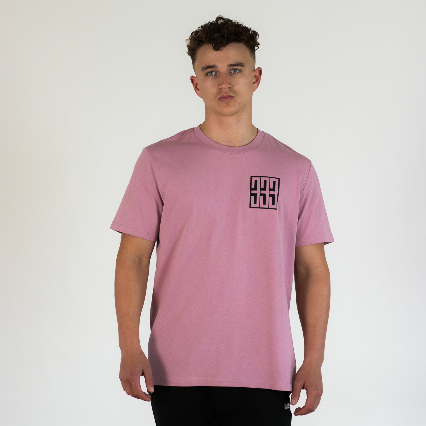 model wearing pink boxed t shirt