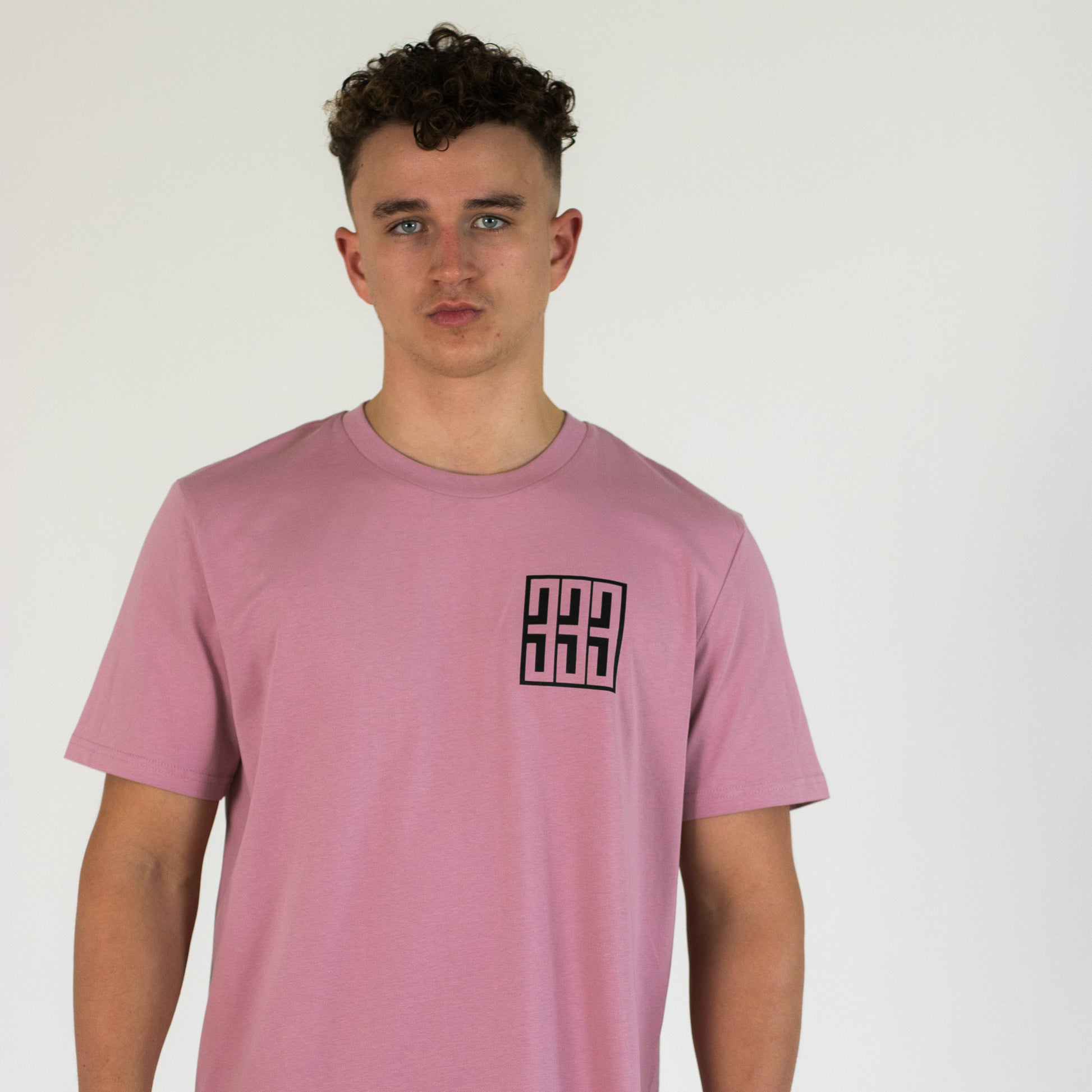 model wearing pink triple 3 skateboards