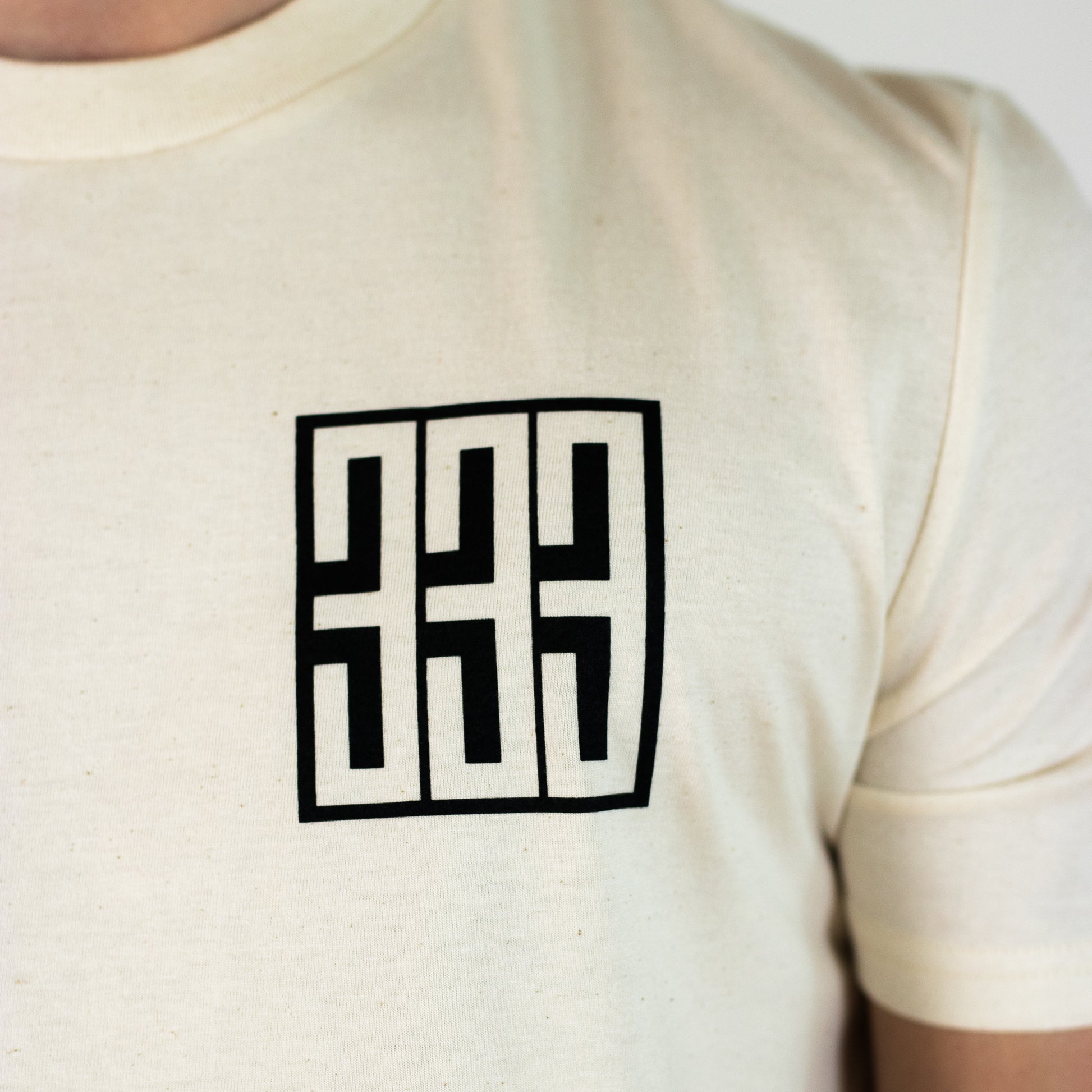 triple 333 skateboards graphic on front breast of t shirt