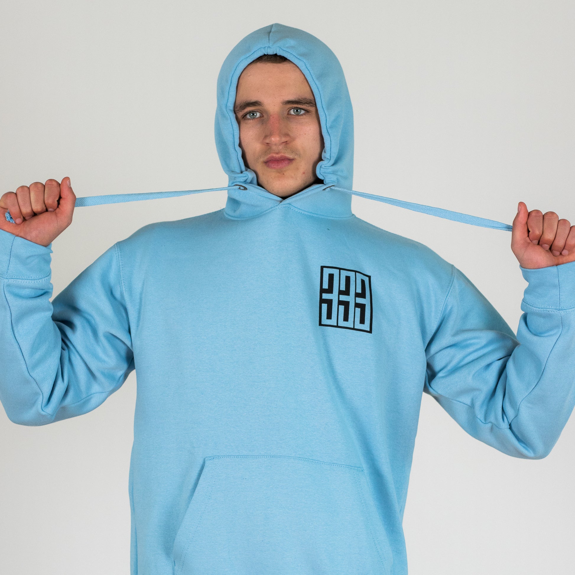 model wearing triple 3 powder blue hoody