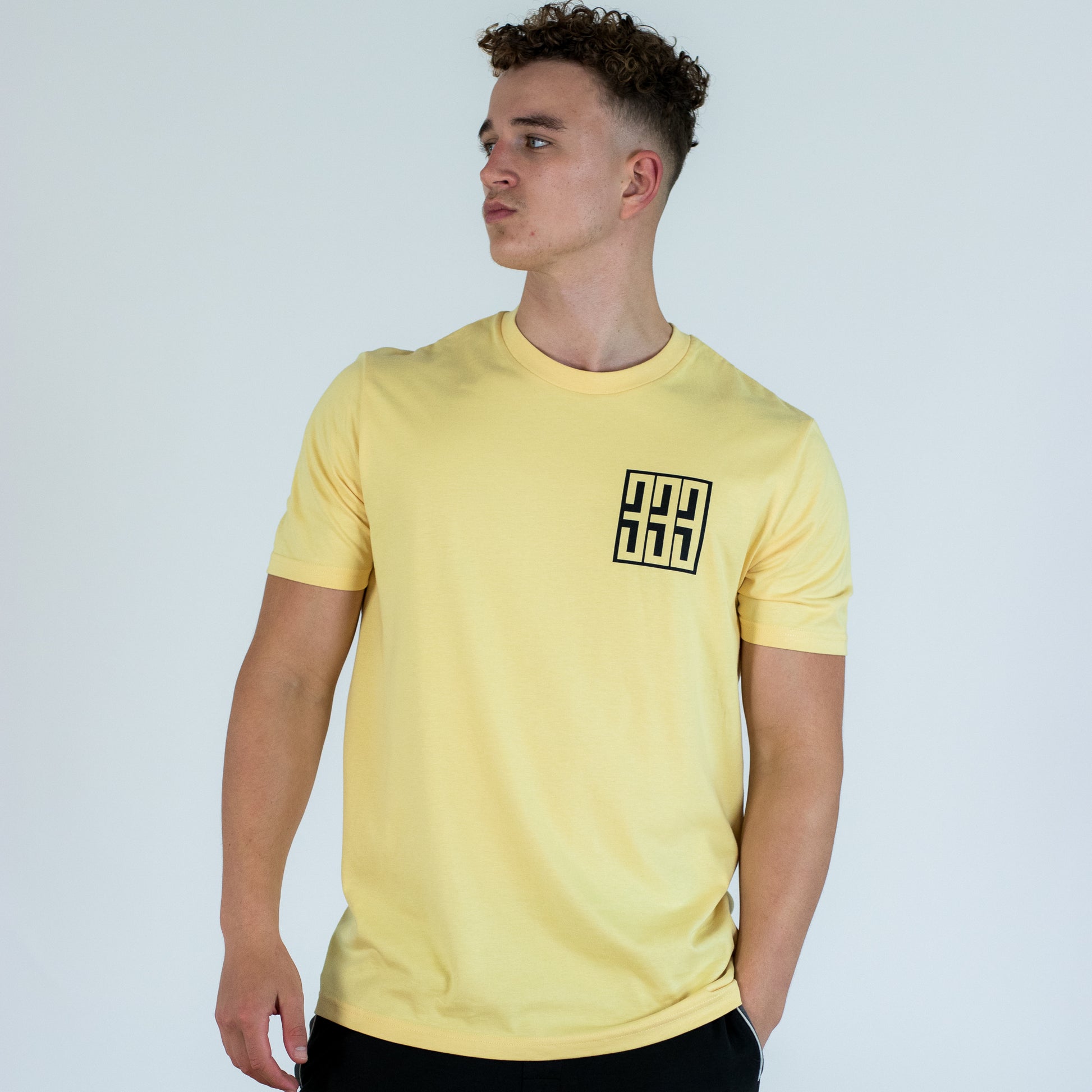 model wearing yellow 333 t shirt